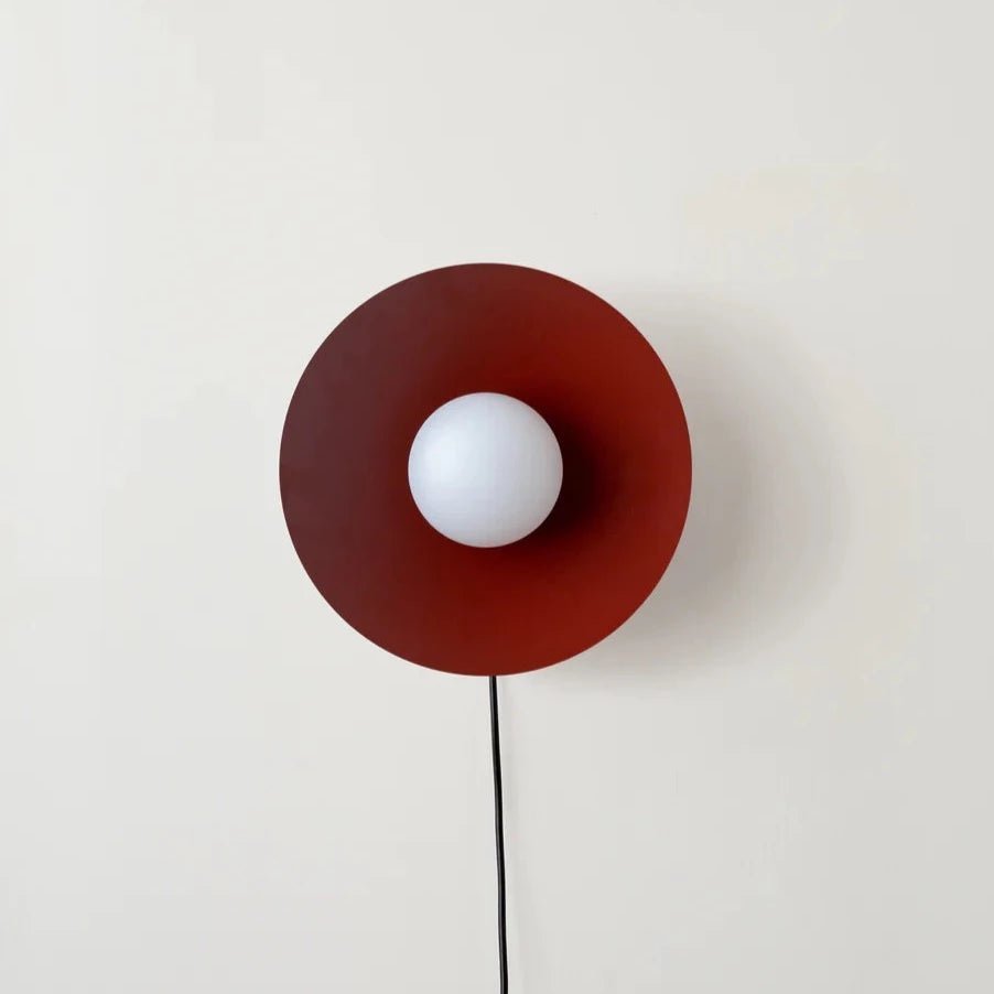 An ARUNDEL ORB SURFACE MOUNT wall lamp in a Gestalt Haus-inspired setting.
