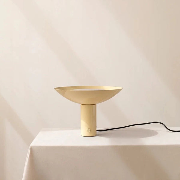 An ARUNDEL UP LIGHT by IN COMMON WITH in front of a white wall at Gestalt Haus.