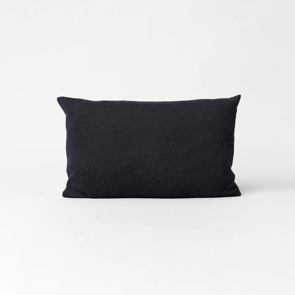 An AYMARA LONG CUSHION by FORM & REFINE on a white background at Gestalt Haus.