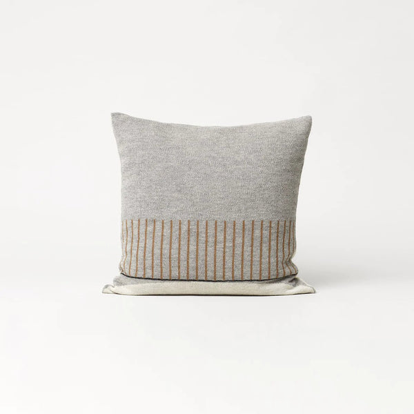 An AYMARA SQUARE CUSHION with a grey and brown stripe design by FORM & REFINE, available at Gestalt Haus.