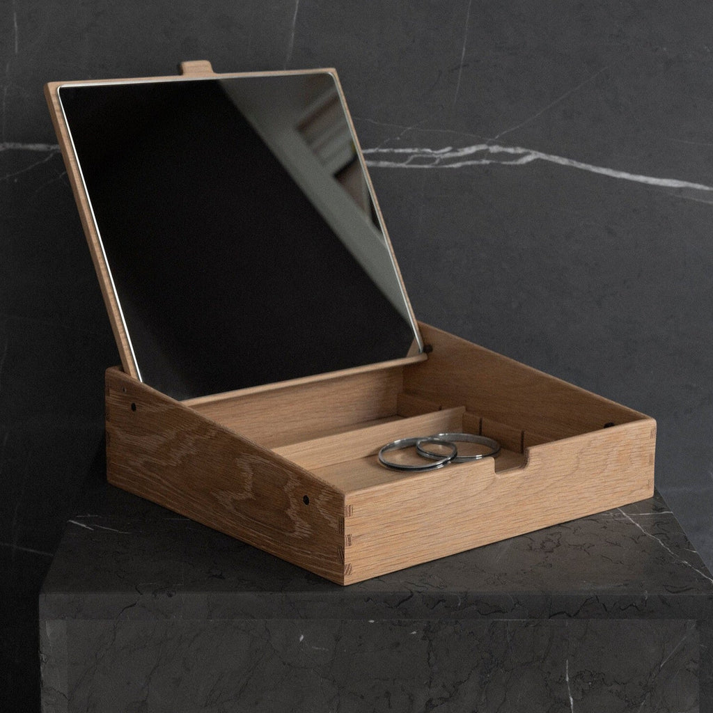 A KLASSIK STUDIO BEAUTY BOX featuring a mirror on top, inspired by the aesthetics of Gestalt Haus.