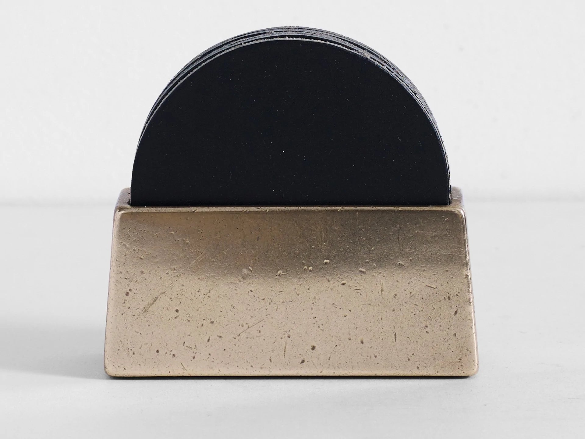 https://gestalt-haus.com/cdn/shop/products/brass-coaster-holder-with-coasters-gestalt-haus-290904.webp?v=1689172610