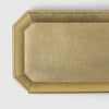 A brass stationery tray by Futagami in an octagonal shape from Gestalt Haus.