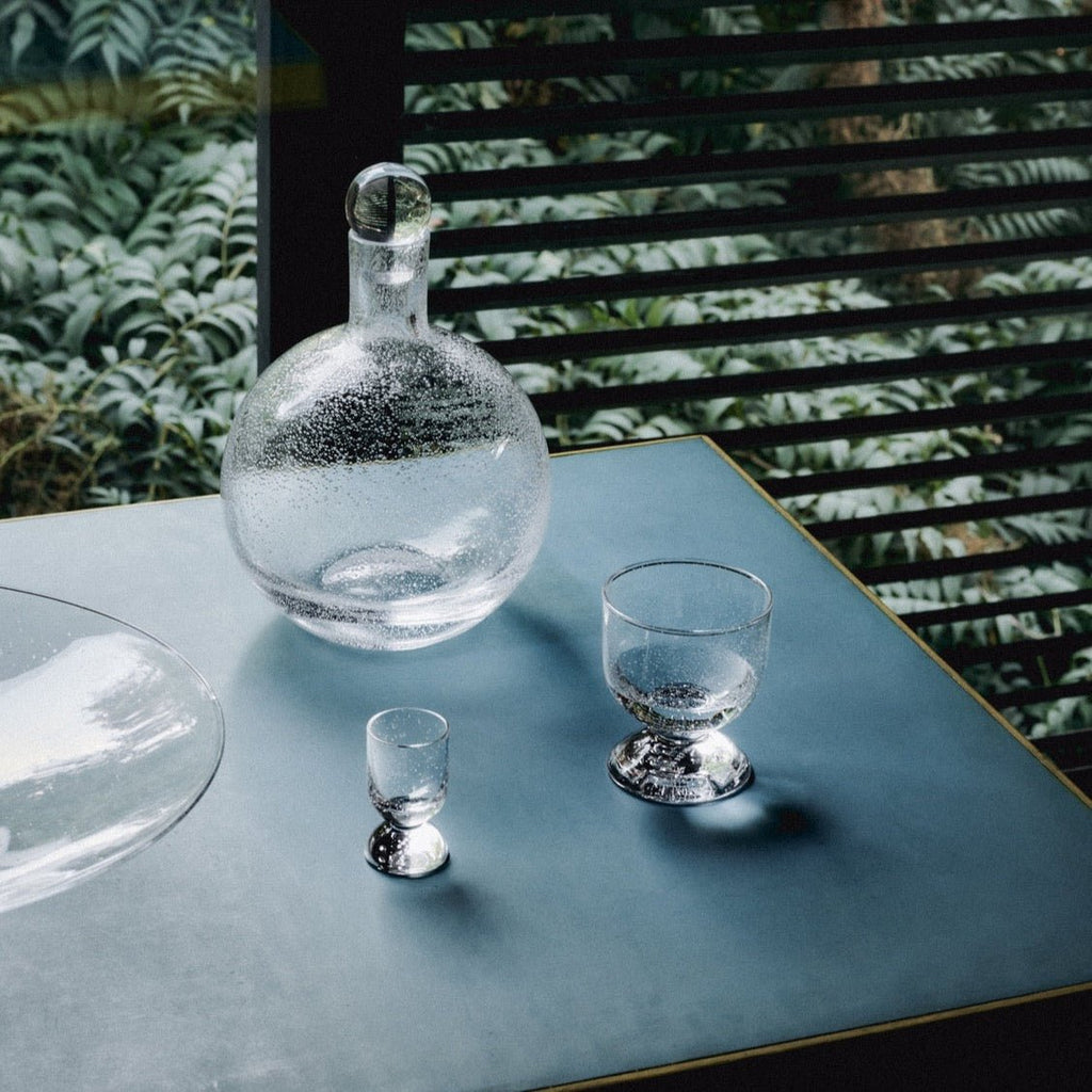 A Louise Roe carafe and glasses set in a Gestalt Haus style arrangement.