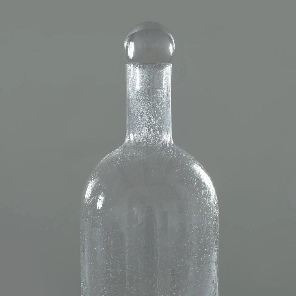A Louise Roe Bubble Glass Carafe on a gray background, showcased in the Gestalt Haus style.