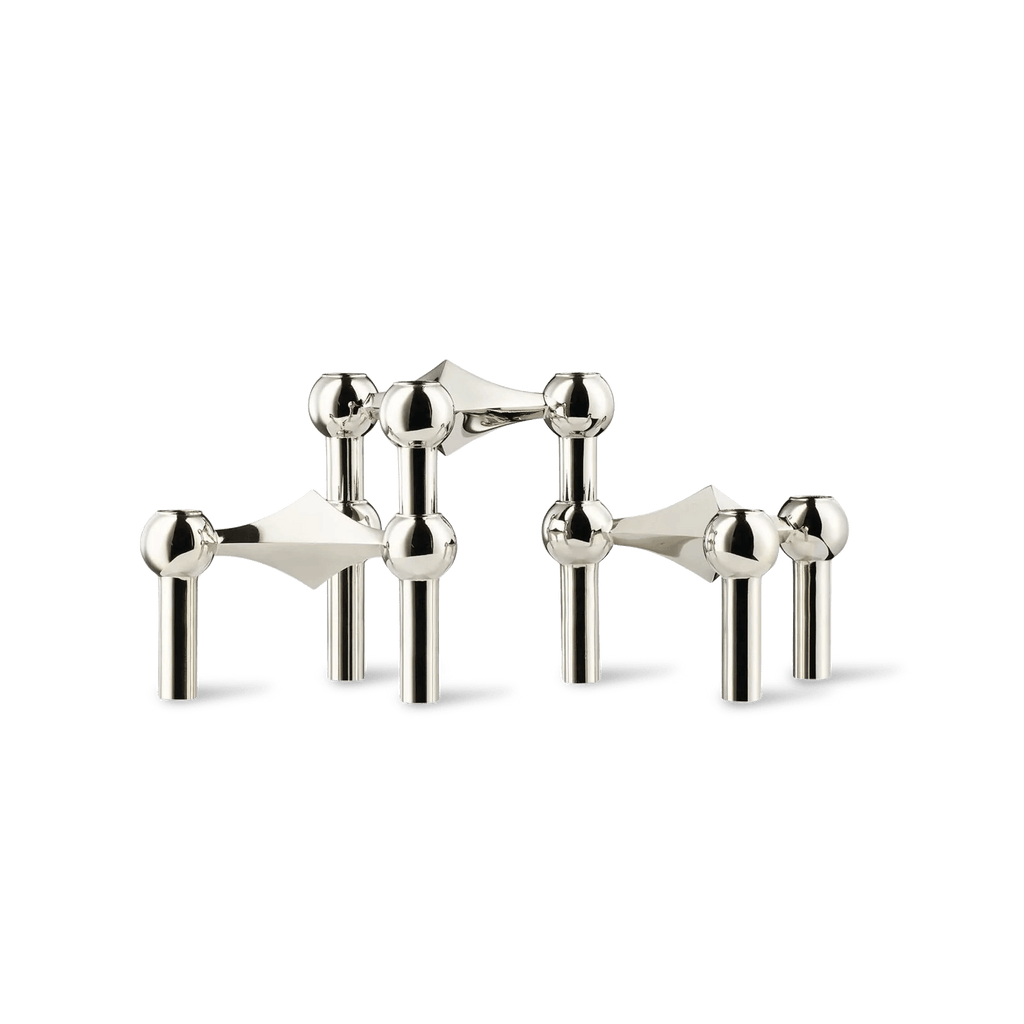 A set of three STOFF NAGEL silver metal CANDLE HOLDERS on a white background showcasing Gestalt Haus design.
