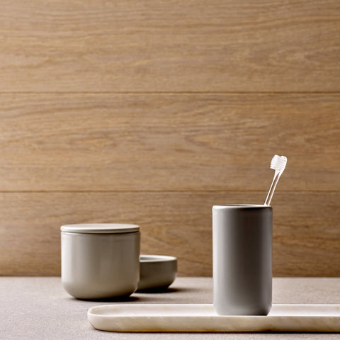 A Ceramic Bathroom Set with Oak Tray featuring a cup and spoon.