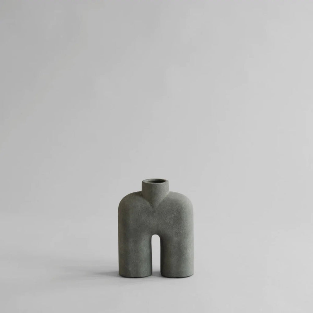 A COBRA TALL SCULPTURES vase by 101 COPENHAGEN sitting on a white surface at the Gestalt Haus.