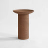 A Gestalt Haus COLUNA VASES table with a circular base in a brown color.
