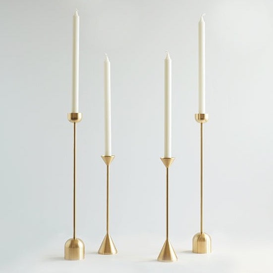 Three Gestalt Haus candle holders on a white background.