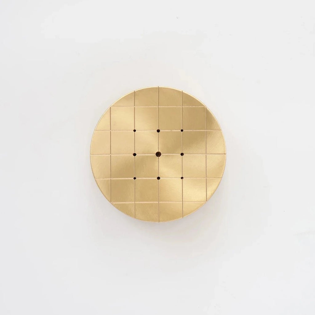 An ORIGIN MADE CONSTELLATION INCENSE BURNER with Gestalt Haus-inspired design featuring holes on it.