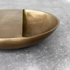 A small COVA BOWL by BRANDT COLLECTIVE displayed on a concrete surface at Gestalt Haus.