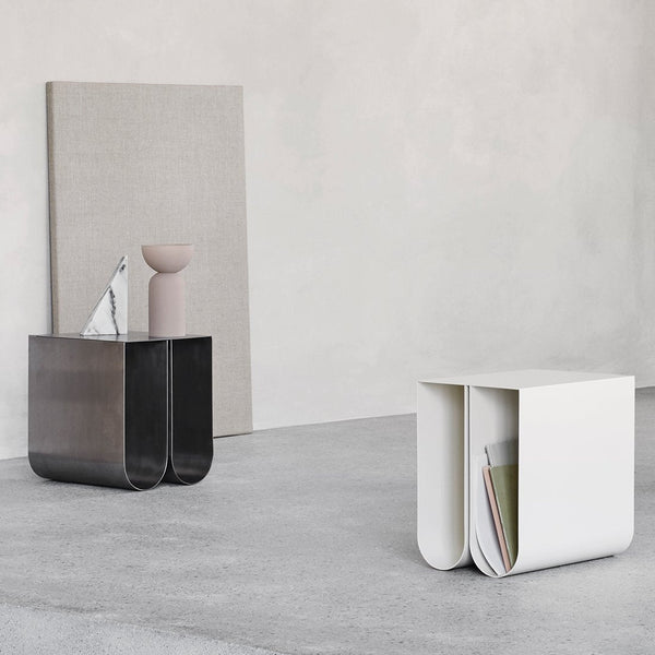 A pair of Kristina Dam Studio CURVED SIDE TABLEs in a white Gestalt Haus.