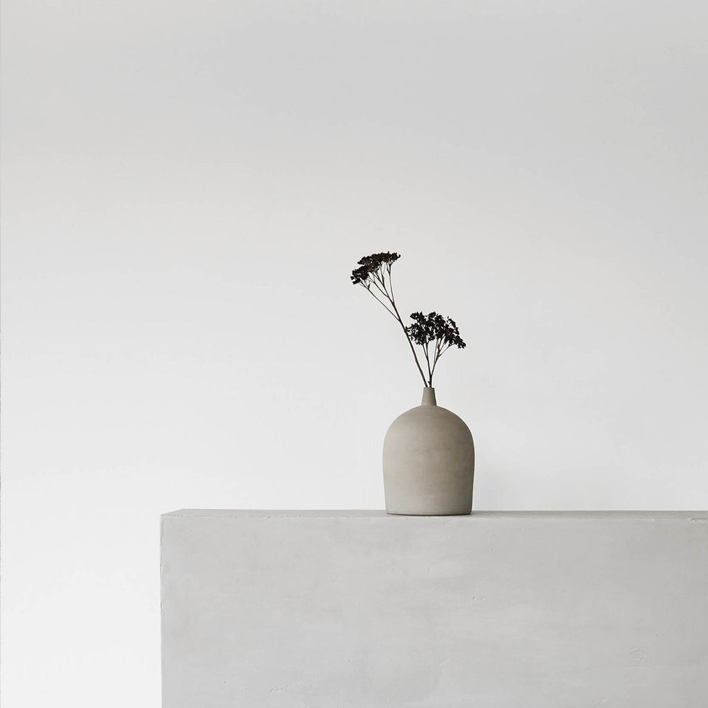 A KRISTINA DAM STUDIO Dome Vase sits on top of a Gestalt Haus.
