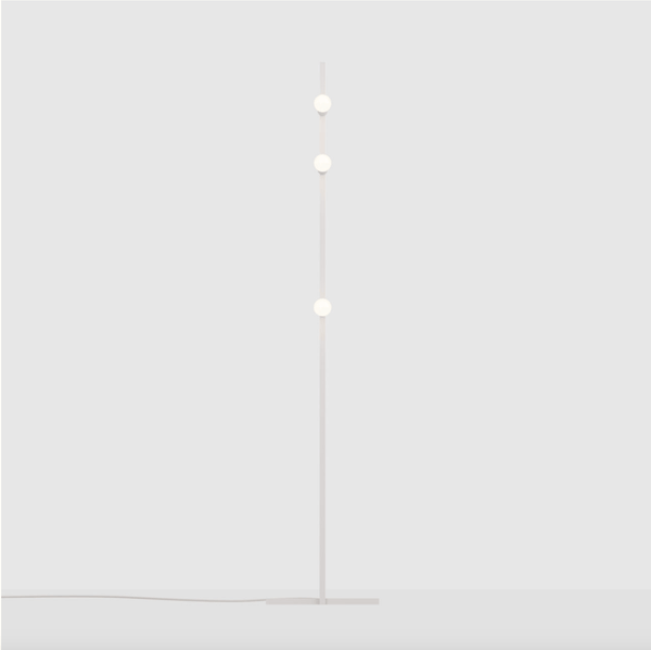 A DOT LINE FLOOR LAMP by LAMBERT ET FILS with three balls on it.