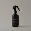 A FIG LEAF AMBIENCE MIST bottle with a black sprayer on a white background, from the brand Gestalt Haus.