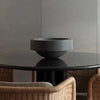 A Louise Roe Gallery OBJECT BOWL sits on a table in a dining room, adding a touch of Gestalt Haus design.