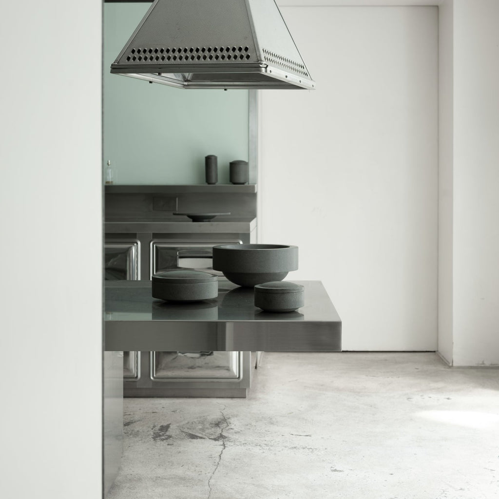 A modern kitchen with a Louise Roe stainless steel hood named the Gestalt Haus.