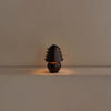 A small black Gestalt Haus TABLE LAMP sitting on a table.