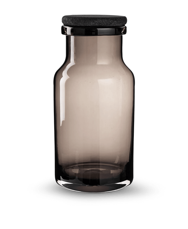 A Louise Roe glass jar with a black lid on a white background, showcasing Gestalt Haus design.