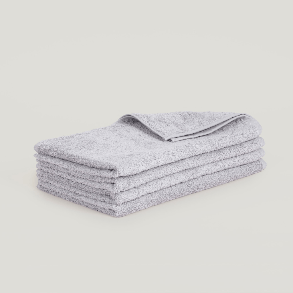 A stack of Gestalt Haus hand towels on a white background.