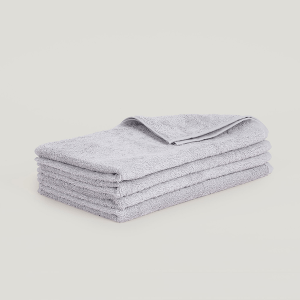 A stack of Gestalt Haus hand towels on a white background.