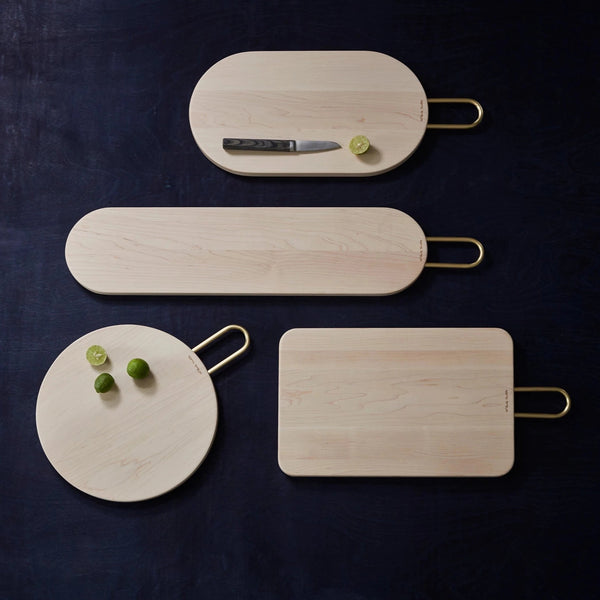 Four Heath Maple cutting boards with a knife and lime branded by Aaron Probyn.