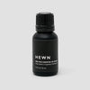 Essential oils from the brand HEWN on a white background with Gestalt Haus influence.