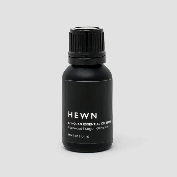 Hewn essential oils on a white background with Gestalt Haus influences.