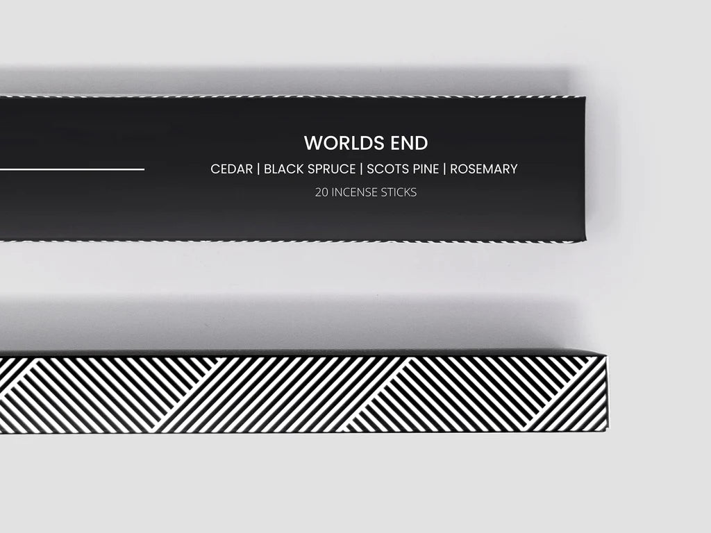 A black and white box with words HEWN INCENSE printed on it, inspired by the Gestalt Haus.