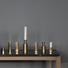 A set of Gestalt Haus HEXAGON CANDLE HOLDERS on a table.