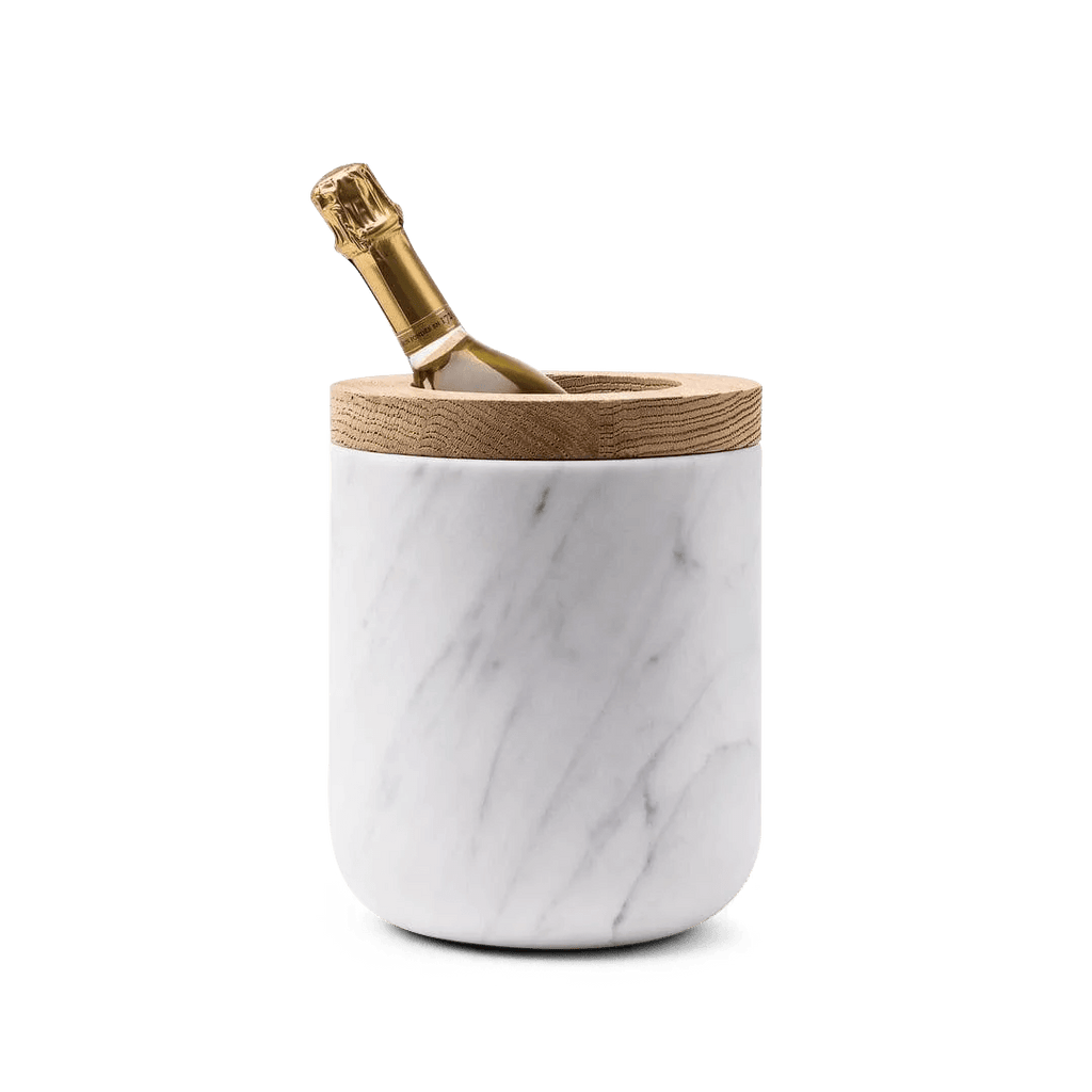 A Carrara marble bottle holder with wooden handle designed by Gestalt Haus.