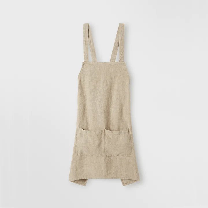 The JUDE LINEN APRON by CULTIVER is hanging on a white wall at Gestalt Haus.