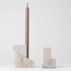 A pair of OFFSET CANDLE HOLDER VOL. 2 from KRISTINA DAM STUDIO with a candle in the middle, showcasing Gestalt principles.