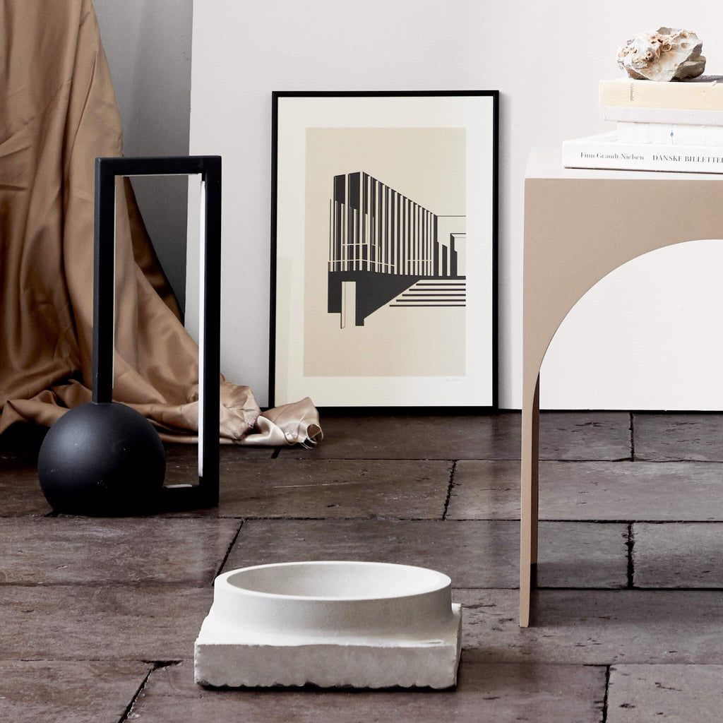 A KRISTINA DAM STUDIO table with a LACUNA SHAPE bowl and framed picture in the Gestalt Haus.