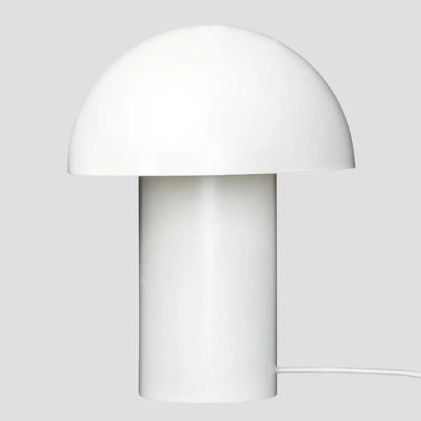 A white LEERY TABLE LAMP from GEJST exhibiting a minimalist design with a white mushroom on top, evoking Gestalt Haus aesthetics.
