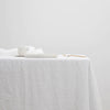 A CULTIVER linen tablecloth adorned with a spoon atop it at Gestalt Haus.