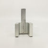 A LUG DOORSTOP from LAKER STUDIO, a square piece of metal on a white background.