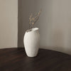 A MAGNOLIA VASE by SIBAST enhances the aesthetic of the wooden table in a Gestalt Haus.
