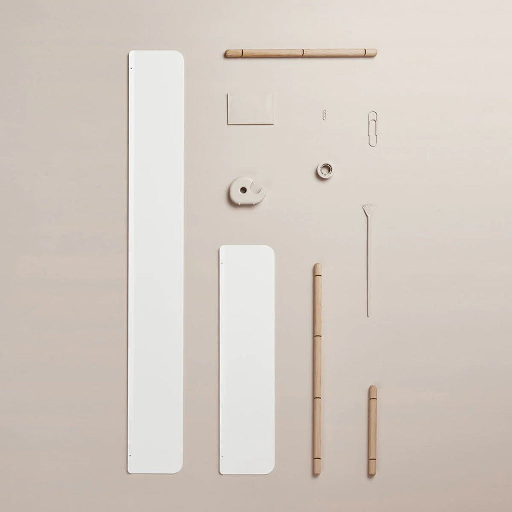 A white NIVO SHELF E, a pencil, a pencil case, and a piece of paper from the brand GEJST available at Gestalt Haus.
