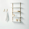 A NIVO SHELF E by GEJST with hooks and a towel hanging on it in a Gestalt Haus.
