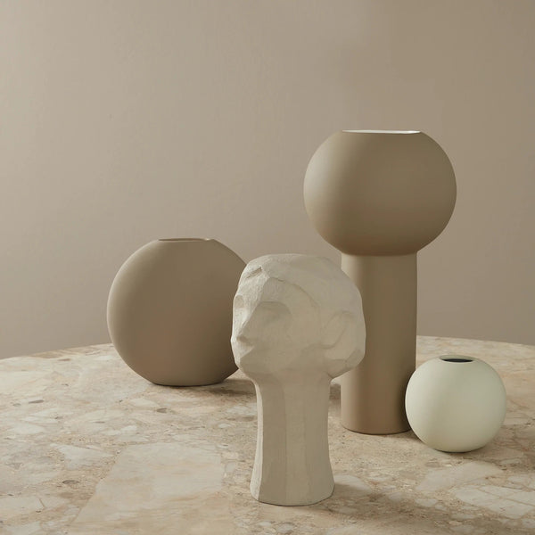 A group of Gestalt Haus COOEE OLLIE sculpture vases on a marble table.