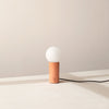An IN COMMON WITH ORB TABLE LAMP with a sphere on top of it, inspired by Gestalt Haus.