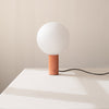 An ORB TABLE LAMP sitting on a white table in a Gestalt Haus.