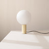 An ORB TABLE LAMP with a sphere on it by IN COMMON WITH, inspired by the Gestalt Haus.