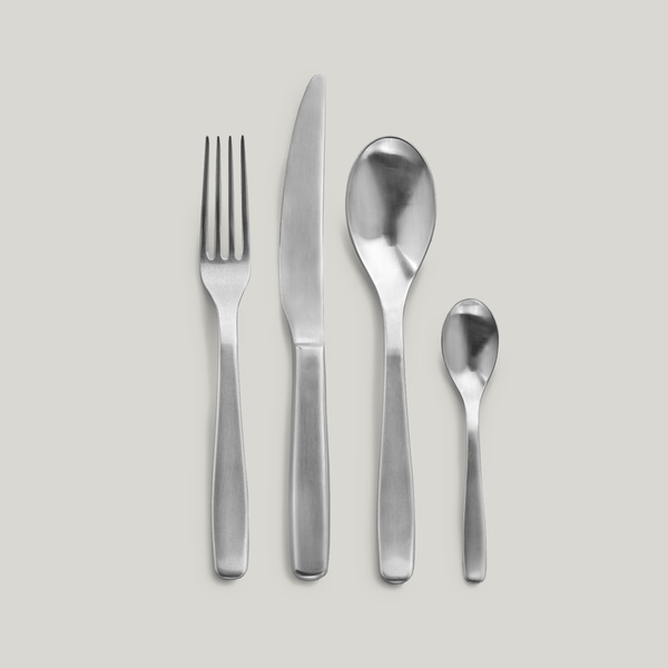 A set of PASSE-PARTOUT FLATWARE BY VINCENT VAN DUYSEN displayed on a white surface, sold under the brand name SERAX.