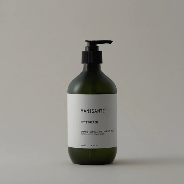 A bottle of Manisante Petitgrain Hand Wash on a white background at Gestalt Haus.