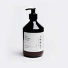 A bottle of Hetkinen Pine Heartwood Hand Soap from Gestalt Haus with black writing on it.