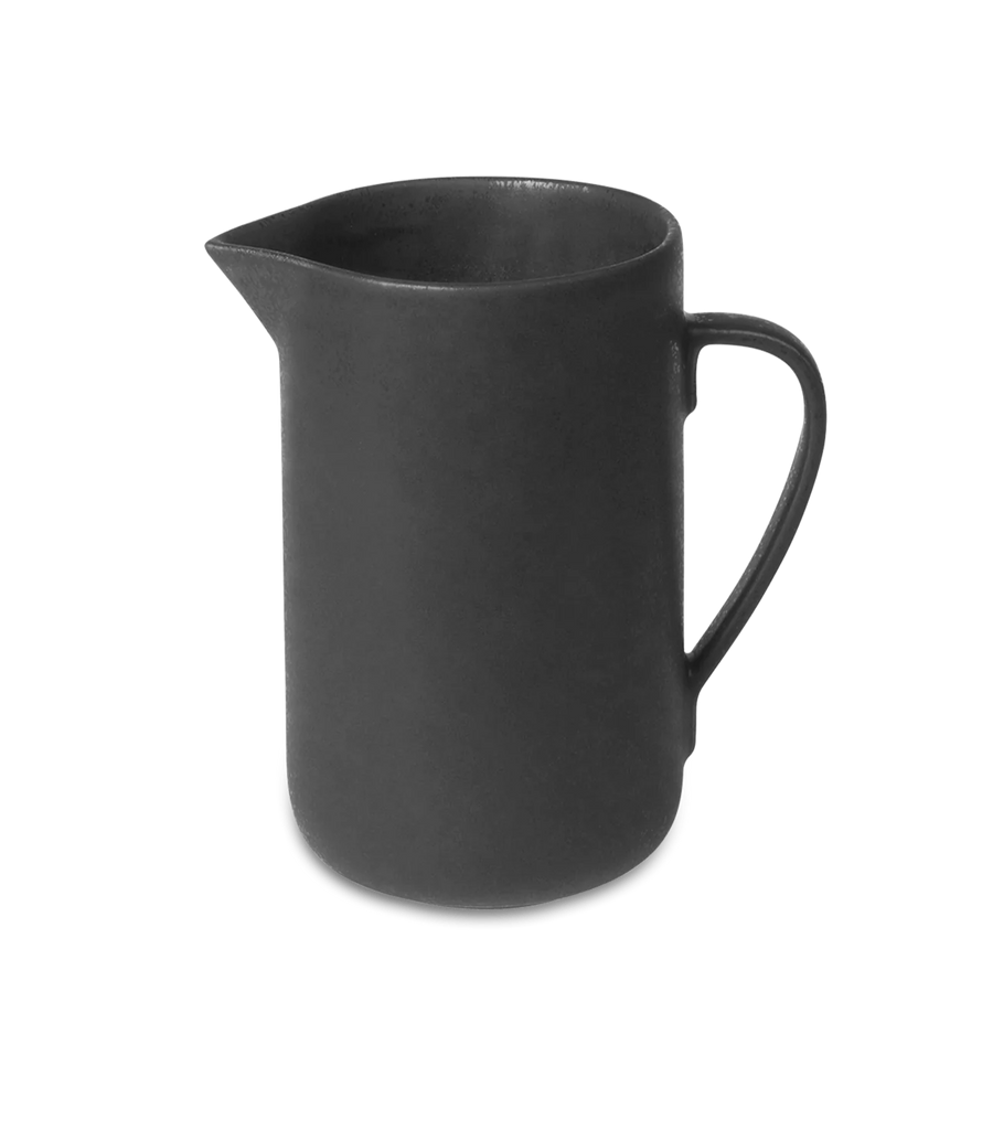 A PISU pitcher by LOUISE ROE on a black background with Gestalt Haus influence.