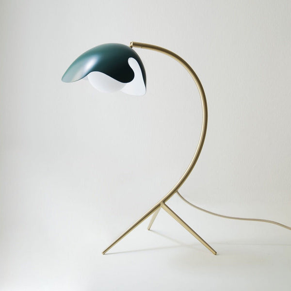 A PS38 TABLE LAMP with a green shade and an ATBO brass base from Gestalt Haus.